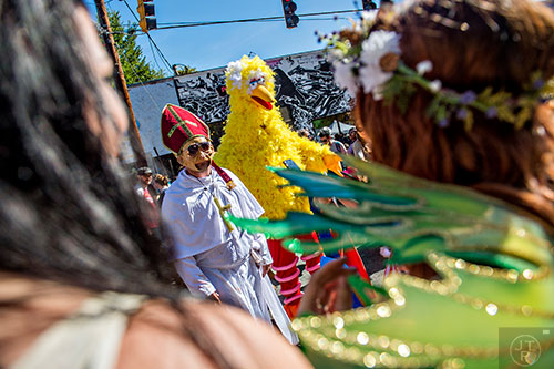 Dressed as the pope, Joey Lewis, has his photo taken with Jason Dodds as Big Bird before the start of the Little Five Points Halloween Parade in Atlanta on Saturday, October 17, 2015. 