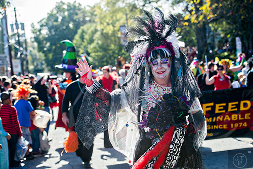 Cheryl Stauss waves to the crowd during the Little Five Points Halloween Parade in Atlanta on Saturday, October 17, 2015. 