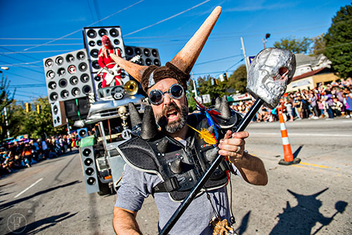 Ryan Vila (center) marches down Moreland Ave. during the Little Five Points Halloween Parade in Atlanta on Saturday, October 17, 2015. 