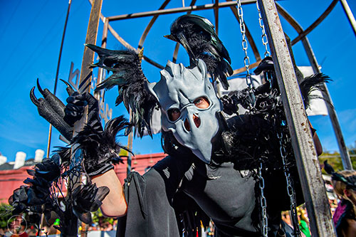 Akiko Jones tries to get free from her cage during the Little Five Points Halloween Parade in Atlanta on Saturday, October 17, 2015. 