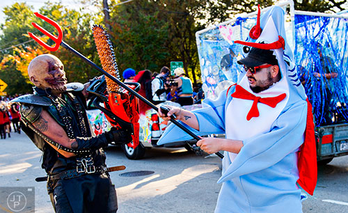 Lucas Godfrey (left) battles Eddie Ray in the street during the Little Five Points Halloween Parade in Atlanta on Saturday, October 17, 2015. 