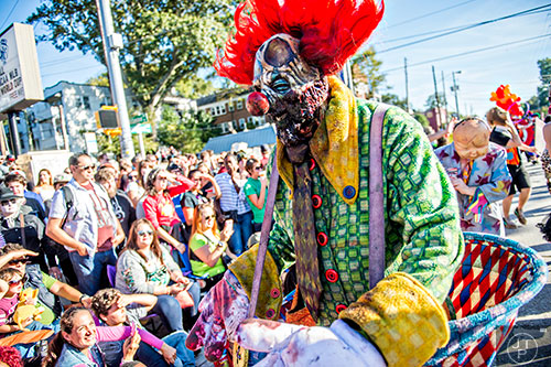 Chris Watson plays up to the crowd during the Little Five Points Halloween Parade in Atlanta on Saturday, October 17, 2015. 