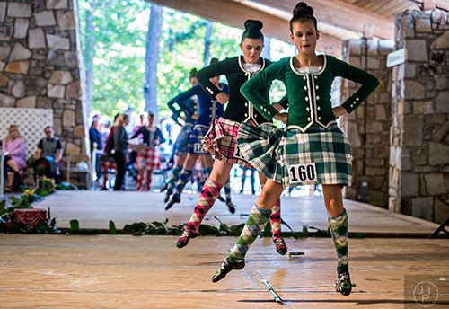 McKenna Lindsay (right) performs in the dancing competition during the 43rd annual Highland Games at Stone Mountain Park on Saturday, October 17, 2015. 