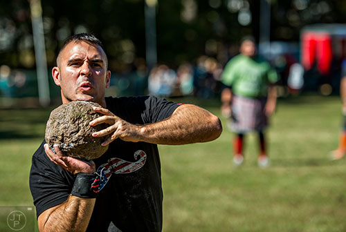 Britton Leitch competes in the open stone event during the 43rd annual Highland Games at Stone Mountain Park on Saturday, October 17, 2015. 