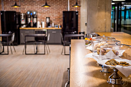 A coffee and snack bar with a kitchen is included when you rent space at Industrious.