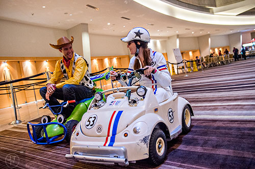 Leah D'Andrea (right) and Bill Winans make their way through the lobby as they head towards the staging area for the annual DragonCon Parade in Atlanta on Saturday. 