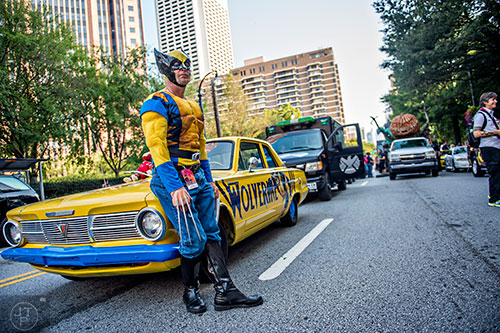 James Shoemaker stands by his car as he waits for the start of the annual DragonCon Parade in Atlanta on Saturday.