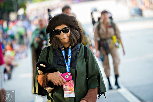 Dressed as Dr. Zira from Planet of the Apes, Mary Lou Valasquez makes her way towards the staging area before the start of the annual DragonCon Parade in Atlanta on Saturday. 