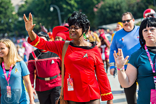 Dressed as Star Trek's Lt. Uhura, Tom McKibben marches down Peachtree St. in Atlanta during the annual DragonCon Parade on Saturday, September 5, 2015.
