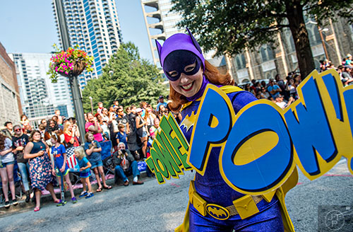 Dressed as Batgirl, Jennifer Rinekso marches down Peachtree St. during the annual DragonCon Parade in Atlanta on Saturday, September 5, 2015.