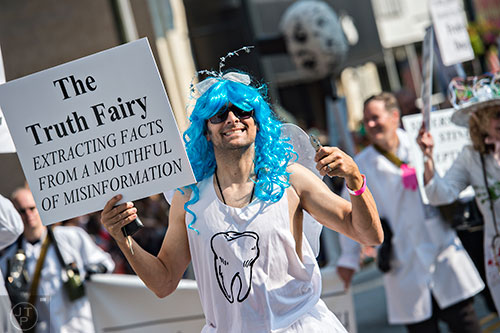 Curt Anderson marches down Peachtree St. in Atlanta during the annual DragonCon Parade on Saturday. 