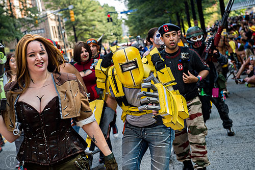 Justin Schwab marches down Peachtree St. in Atlanta during the annual DragonCon Parade on Saturday. 