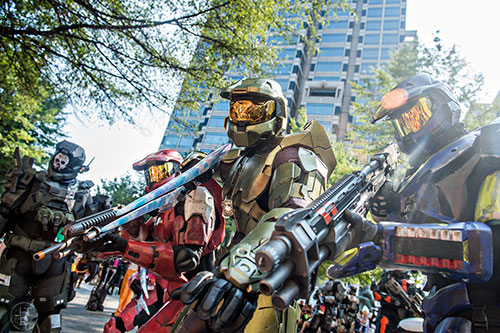 Dressed as Master Chief from the HALO series, Justin Branfuhr (center) plays up to the crowd during the annual DragonCon Parade in Atlanta on Saturday, September 5, 2015.