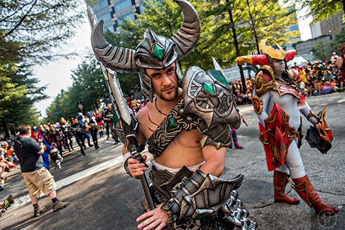Justin Little marches down Peachtree St. in Atlanta during the annual DragonCon Parade on Saturday. 