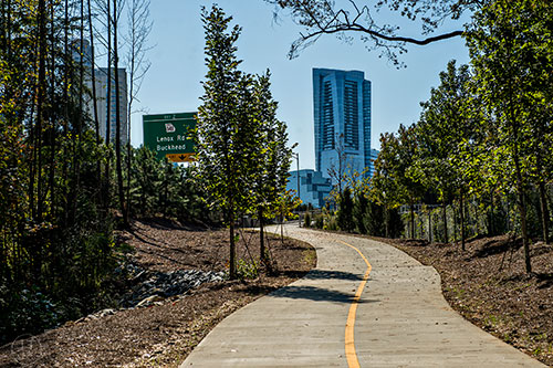 Buckhead buildings and the Lenox Rd. exit sign for GA 400 can be seen from the PATH 400 trail.