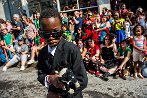 Wearing his Men In Black costume, William Parker marches past tens of thousands of people during the annual DragonCon Parade in Atlanta on Saturday, September 5, 2015.