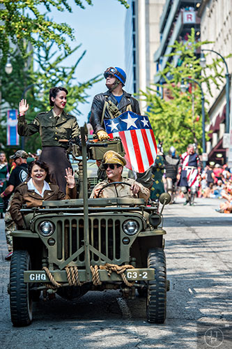 Captain America is driven down the street during the annual DragonCon Parade in Atlanta on Saturday. 