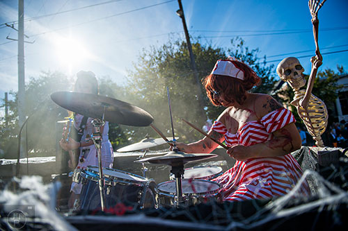 Hymen Moments perform on the back of a float during the Little Five Points Halloween Parade on Saturday, October 17, 2015.
