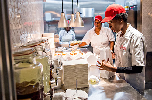 Lunch orders are filled at Hop's Chicken inside Ponce City Market during opening weekend.