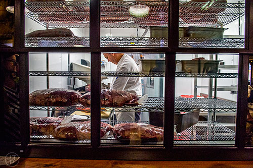 Catch a glimpse at fresh beef patties being made while in line at H&F Burger inside Ponce City Market.