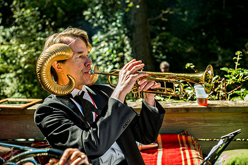 Bo Emerson plays the trumpet with Weapons of Brass Destruction during the Oakhurst Porch Fest on Sunday.