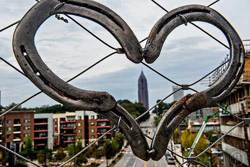 A heart decorates the fence near Ponce City Market along the Art on the Beltline project.