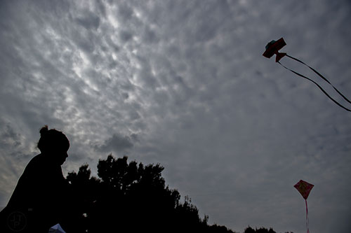 Cameryn McCray flies a kite during the Atlanta World Kite Festival at Piedmont Park on Saturday, October 24, 2015. 