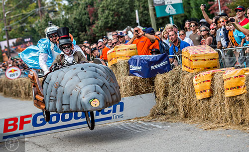 Josh Weinstein (right) pilots his vehicle over the jump during the Red Bull Soap Box Derby in Atlanta on Saturday, October 24, 2015. 