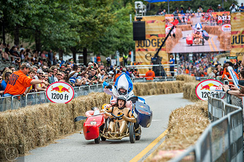 The TEKES team heads towards the finish line on North Ave. during the Red Bull Soap Box Derby in Atlanta on Saturday, October 24, 2015. 