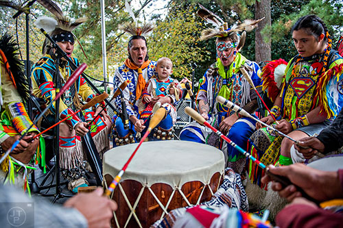 Ryan Little Eagle (left), Colin Fuller, James Delgadillo, Jacob Gober and Josh Degadillo play a ceremonial drum during the Indian Festival & Pow Wow at Stone Mountain Park on Saturday, October 31, 2015. 