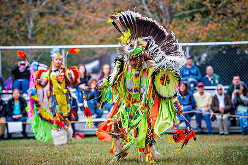 Robin Jumper (right) and Josh Delgadillo dance during the Indian Festival & Pow Wow at Stone Mountain Park on Saturday, October 31, 2015. 