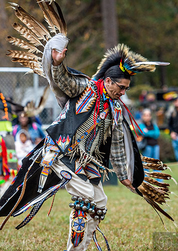 Joe Delgadillo dances during the Indian Festival & Pow Wow at Stone Mountain Park on Saturday, October 31, 2015. 