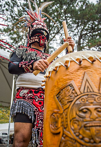 Javier Alfaro plays his drum during the Indian Festival & Pow Wow at Stone Mountain Park on Saturday, October 31, 2015. 
