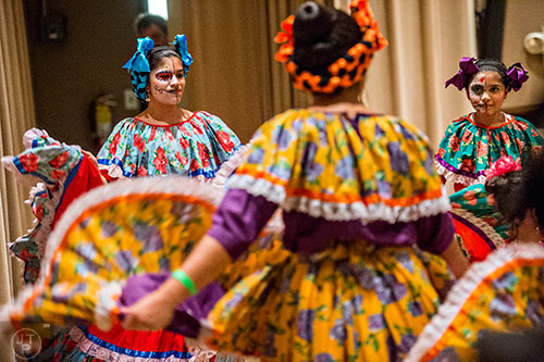 Lilly Milani (left) and her sister Elahe (right) dance during the Dia De Muertos, or Day of the Dead, Festival at the Atlanta History Center on Sunday, November 1, 2015. 