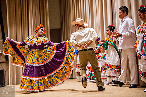 Kaylee Milani (left) dances with Cydney Caarrubias during the Dia De Muertos, or Day of the Dead, Festival at the Atlanta History Center on Sunday, November 1, 2015. 