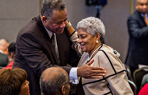 Former Atlanta Mayor Shirley Franklin (right) receives a hug from Anthony Motley before speaking in a panel discussion at the Center for Civil and Human Rights in Atlanta on Wednesday, November 4, 2015.   