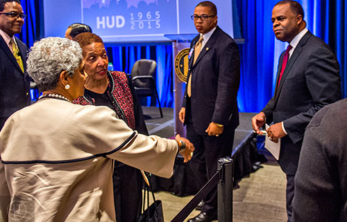 Atlanta Mayor Kasim Reed (right) turns to shake hands with former Atlanta Mayor Shirley Franklin (left) and Renee Glover before a panel discussion at the Center for Civil and Human Rights in Atlanta on Wednesday, November 4, 2015.   