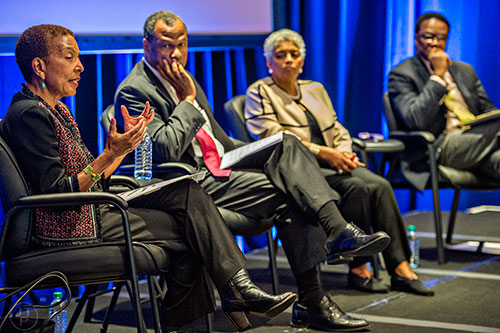 Renee Glover (left), Egbert Perry, Shirley Franklin and Dr. Thomas Boston speak during a panel discussion at the Center for Civil and Human Rights in Atlanta on Wednesday, November 4, 2015.   