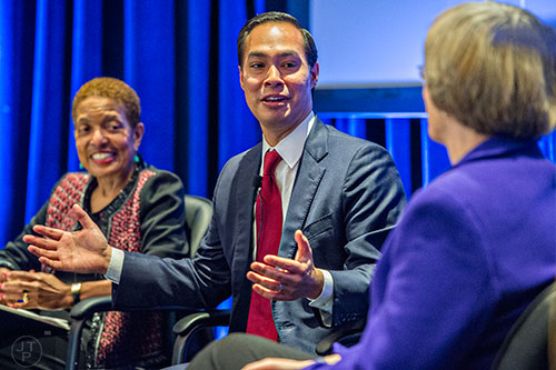 U.S. Housing and Urban Development Secretary Julian Castro (center) speaks with  Renee Glover (left) and Dr. Drew Faust at the Center for Civil and Human Rights in Atlanta on Wednesday, November 4, 2015.   