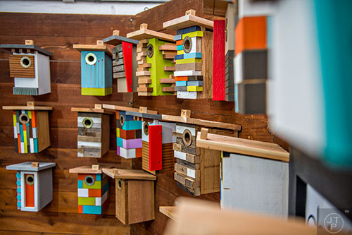 Birdhouses designed by Matt Estrada sit on display in his booth during the Chastain Park Arts Festival on Saturday, November 7, 2015. 