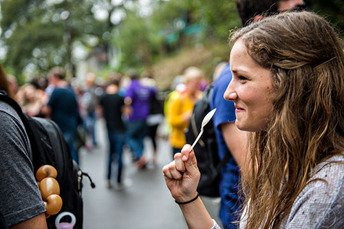 Sara Skiba holds her spoon as she waits in line to try chili during the Cabbagetown Chomp & Stomp in Atlanta on Saturday, November 7, 2015. 