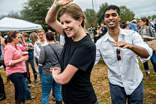 Margaret Tilson (left) dances with Kishore Devisetti during the Cabbagetown Chomp & Stomp in Atlanta on Saturday, November 7, 2015. 