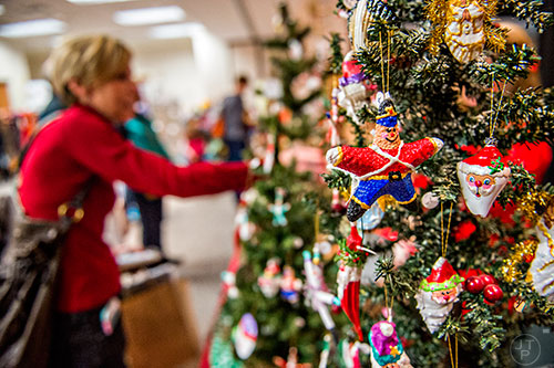 Ornaments sit on display as Pam Tallmadge buys gifts during the Dunwoody United Methodist Church Holiday Festival on Saturday, November 14, 2015. 
