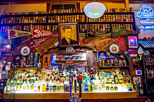 A quick glance behind the bar at Manuel's Tavern reveals the rich history of Atlanta.