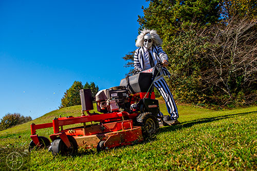 Beetlejuice mows a yard in Peachtree Corners on Friday, October 30, 2015.