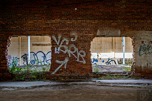 Graffiti marks the inside of the main building on the Atlanta Dairies property off of Memorial Dr. in downtown.