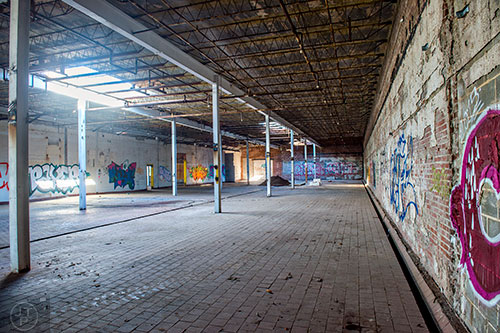 Graffiti marks the inside of the main building on the Atlanta Dairies property off of Memorial Dr. in downtown.