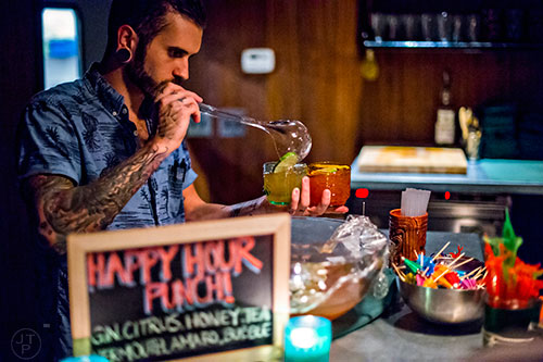 Serving up some Happy Hour Punch at S.O.S. Tiki Bar in Decatur.