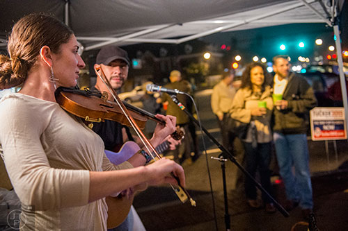 Faye Petree (left) and Mikhail Petersen perform live during the election night party in Tucker on Tuesday.