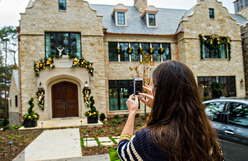 Carolyn Krieger takes a photo of the 2015 Home for the Holidays Designer Showhouse located at 1150 West Garmon Rd. in Atlanta on Saturday, November 21, 2015. 
